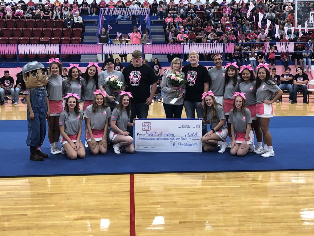 Cheerleaders & Roughneck Joe with Donation for Pinktober